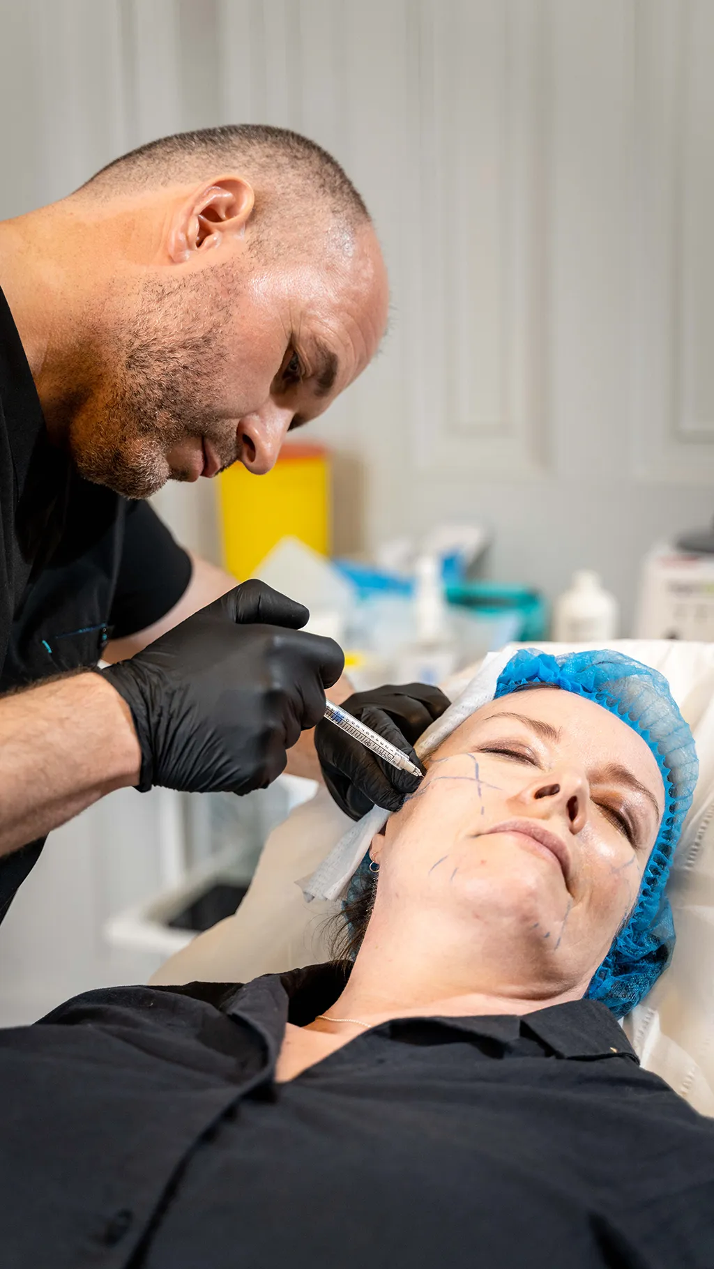 A delegate injects a model during aesthetics training