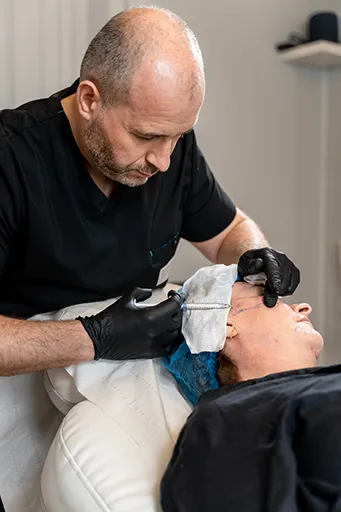 Dr Cormac Lynch injecting a model during a training course